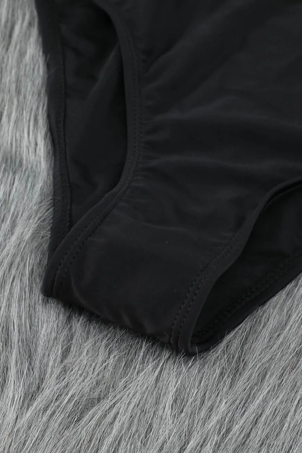 Sophisticated Black High-Waisted Bikini with Romantic Puff Sleeves and Distinctive U-Back Design